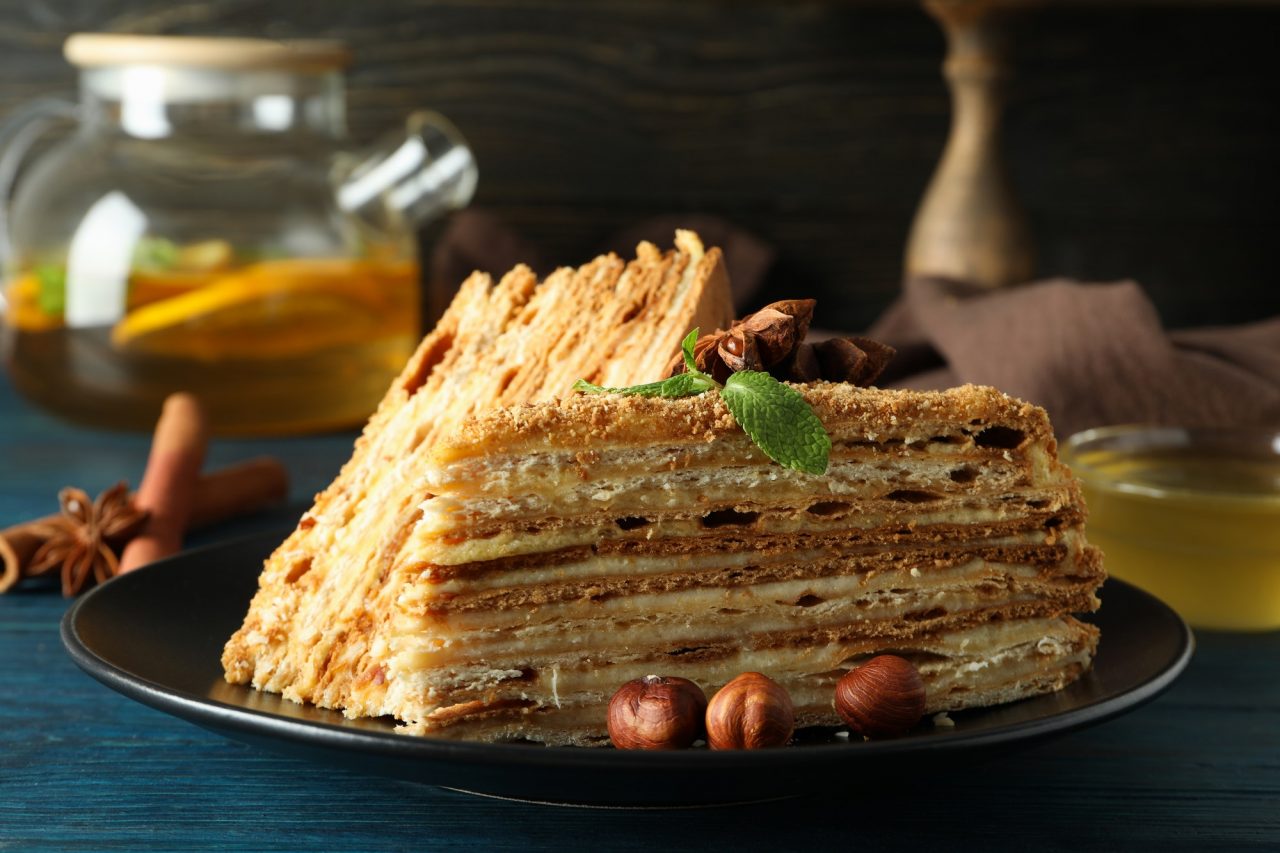 concept-of-tasty-dessert-with-honey-cake-close-up